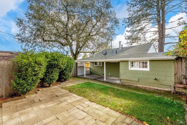 a view of a house with a yard