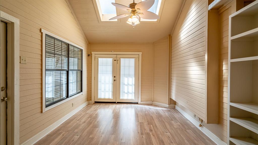 4018 View Point Drive Granbury, TX 76048 - Photo 17 of 38 Second living area with skylight and access to backyard