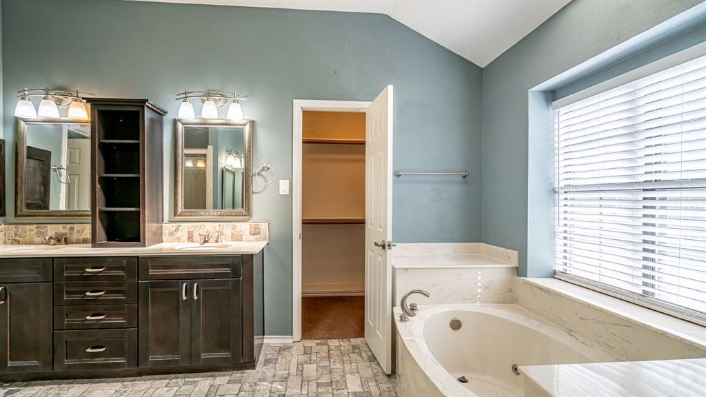 4018 View Point Drive Granbury, TX 76048 - Photo 26 of 38 Updated primary bathroom with walk in closet, dual vanities and jetted garden tub