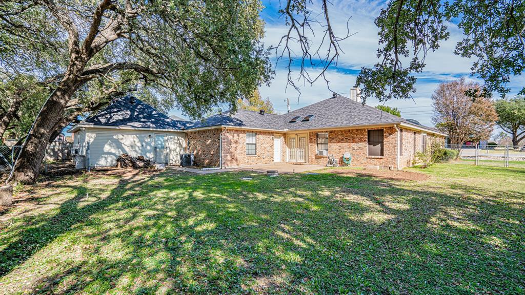 4018 View Point Drive Granbury, TX 76048 - Photo 5 of 38 Large fenced backyard with shade trees