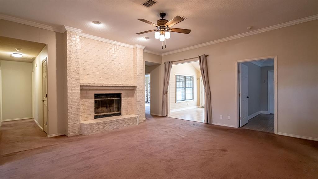 4018 View Point Drive Granbury, TX 76048 - Photo 9 of 38 Living area with beautiful fireplace