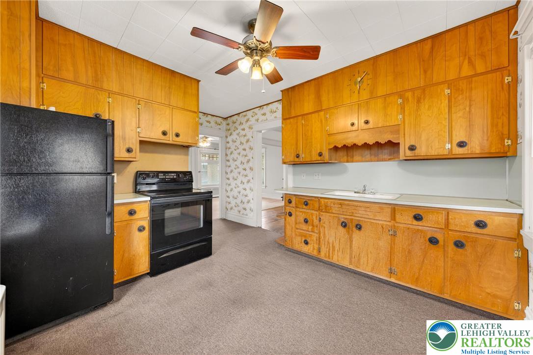 3301 Lehigh Street Whitehall, PA 18052 - Photo 13 of 40 a kitchen with stainless steel appliances granite countertop a stove a refrigerator and a refrigerator