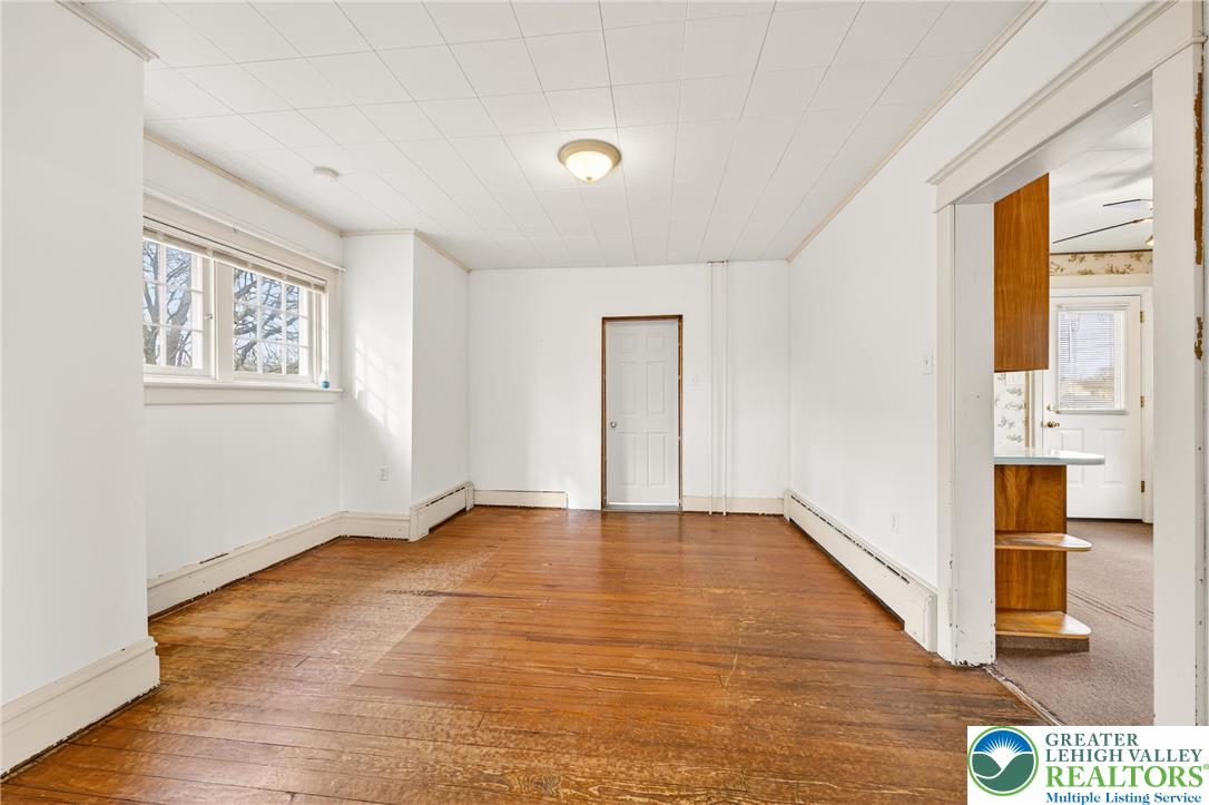 3301 Lehigh Street Whitehall, PA 18052 - Photo 14 of 40 a view of an empty room with wooden floor and a window