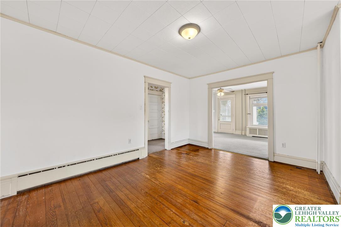 3301 Lehigh Street Whitehall, PA 18052 - Photo 15 of 40 a view of an empty room with wooden floor and a window