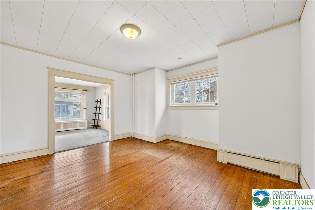 3301 Lehigh Street Whitehall, PA 18052 - Photo 17 of 40 an empty room with wooden floor and windows