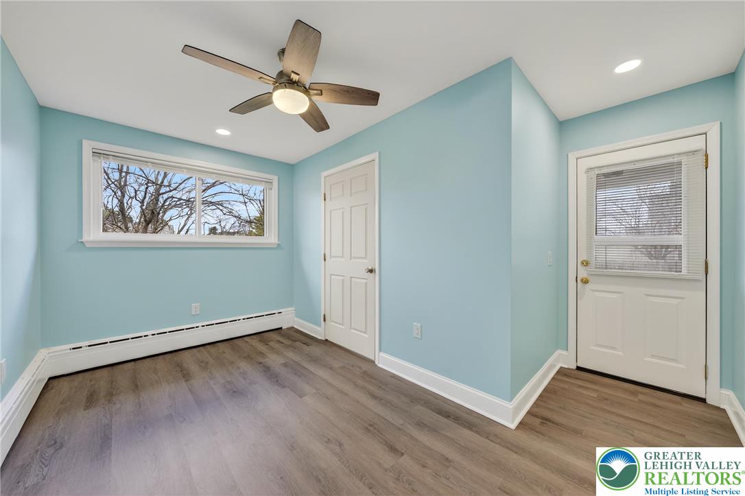 3301 Lehigh Street Whitehall, PA 18052 - Photo 18 of 40 a view of an empty room with wooden floor and a window