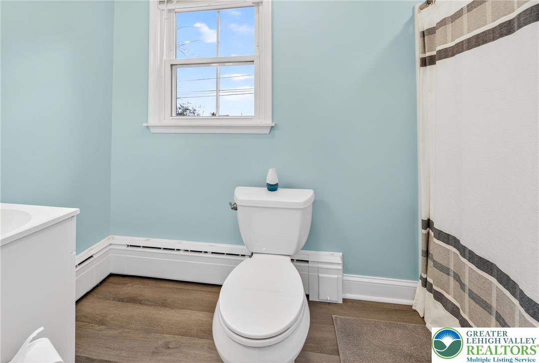 3301 Lehigh Street Whitehall, PA 18052 - Photo 20 of 40 a bathroom with a toilet sink and mirror