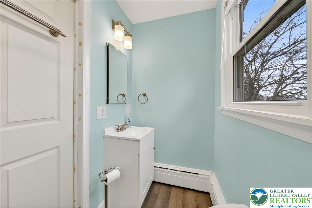 3301 Lehigh Street Whitehall, PA 18052 - Photo 21 of 40 a bathroom with a sink mirror and toilet