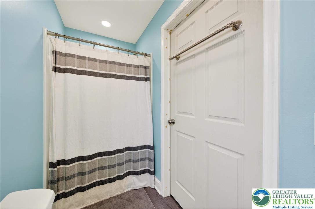 3301 Lehigh Street Whitehall, PA 18052 - Photo 22 of 40 a bathroom with a shower and a mirror