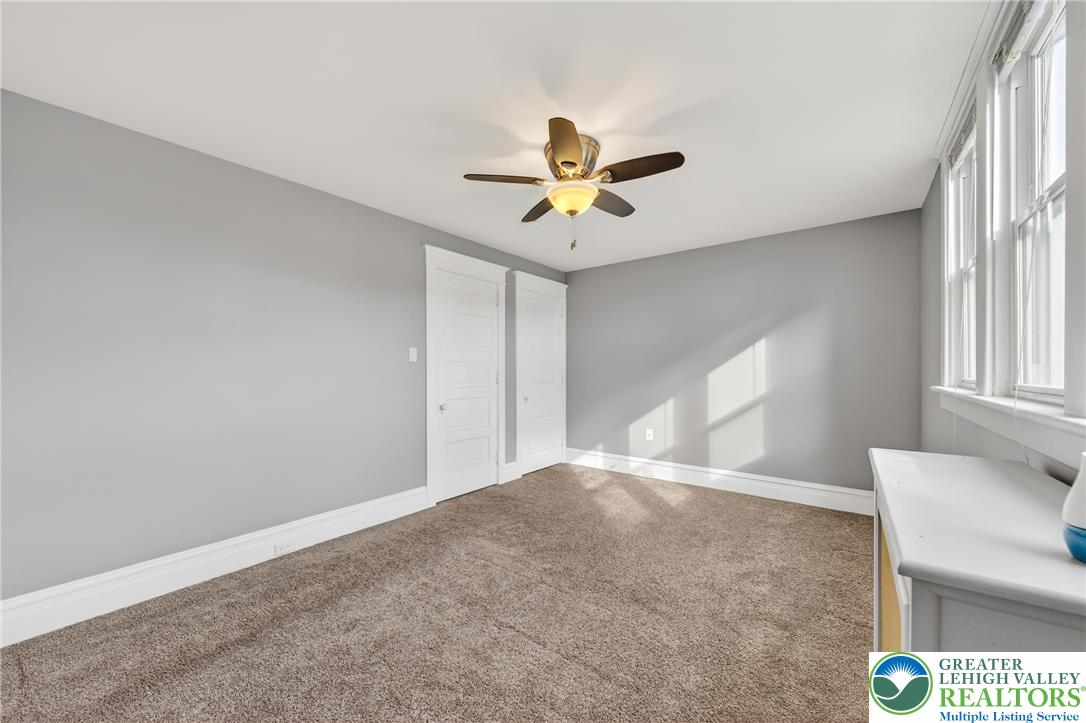 3301 Lehigh Street Whitehall, PA 18052 - Photo 29 of 40 a view of a livingroom with a window and a ceiling fan