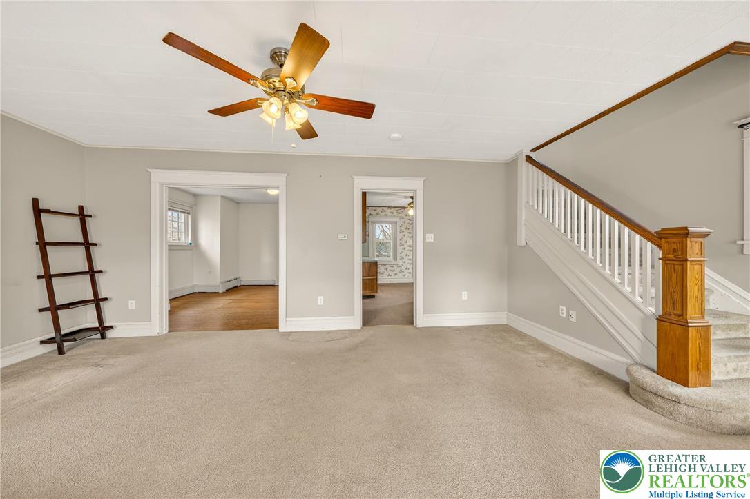 3301 Lehigh Street Whitehall, PA 18052 - Photo 7 of 40 a view of a livingroom with a ceiling fan and window