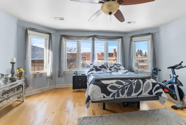 a bed sitting in a room next to a window