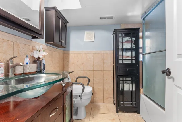 a kitchen with a sink and cabinets