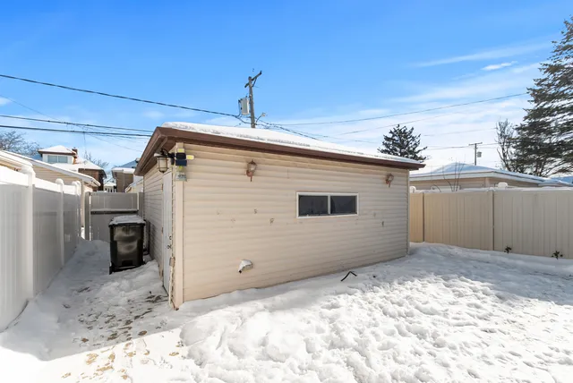 a view of a house with a snow in the background