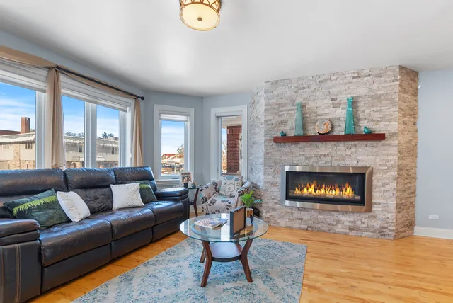 a living room with furniture and a fireplace