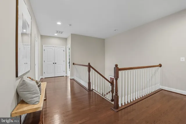 a bedroom with a large bed and a large window