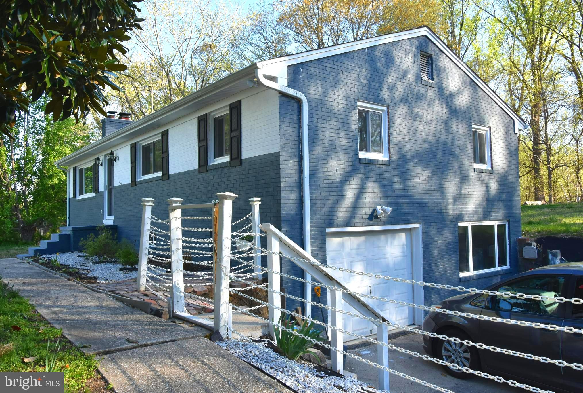 8610 Croom Road Upper Marlboro, MD 20772 - Photo 2 of 2 a front view of a house with plants