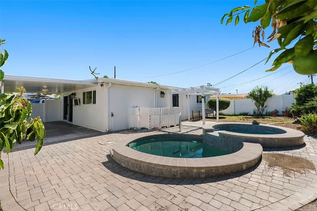 a view of a swimming pool with a patio