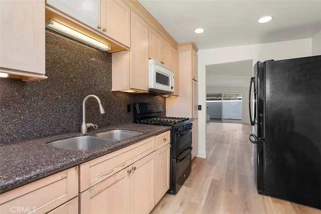 a view of a room with window and ceiling fan