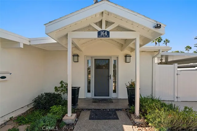 a kitchen that has a sink and a stove