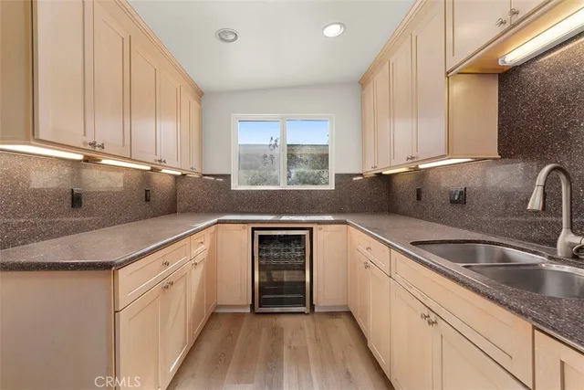 a kitchen with stainless steel appliances granite countertop a stove and a microwave