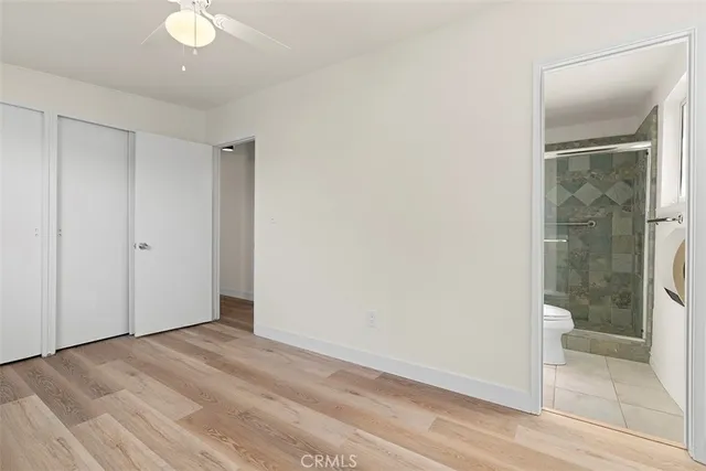 a kitchen with granite countertop a stove and a microwave