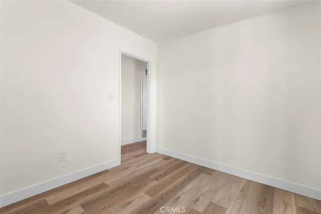 a kitchen with stainless steel appliances granite countertop a refrigerator a sink a stove and oven