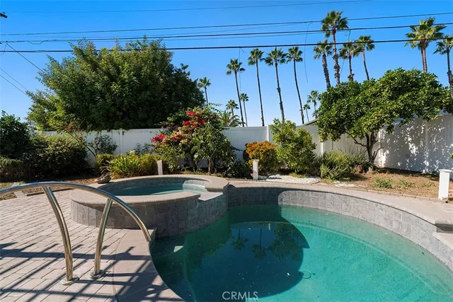 a view of a swimming pool with a patio