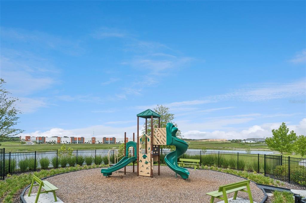 1672 Rider Rain Lane Apopka, FL 32703 - Photo 35 of 35 a view of a park with iron fence
