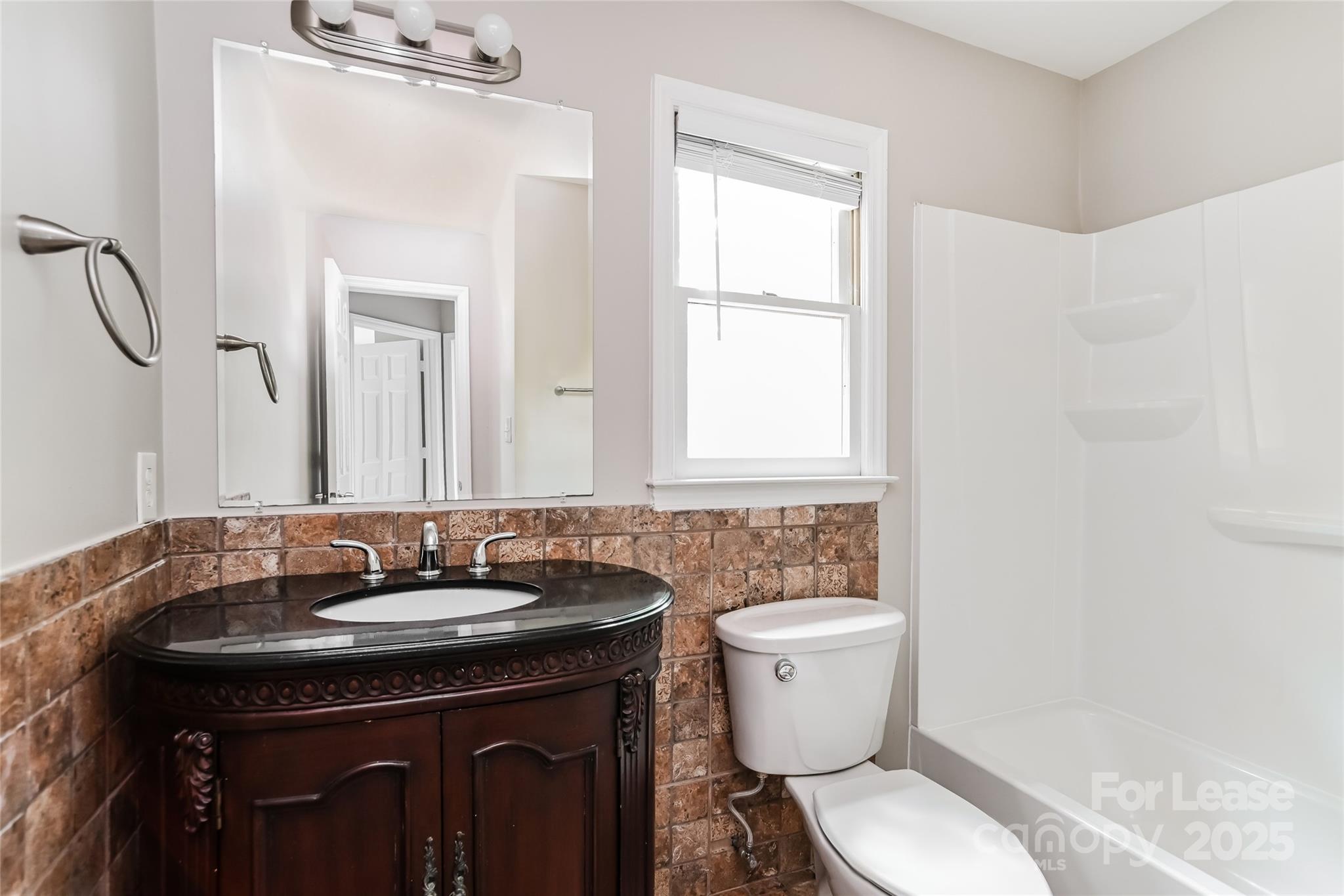 2331 Hunters Bluff Drive Matthews, NC 28105 - Photo 13 of 17 a bathroom with a sink and a toilet