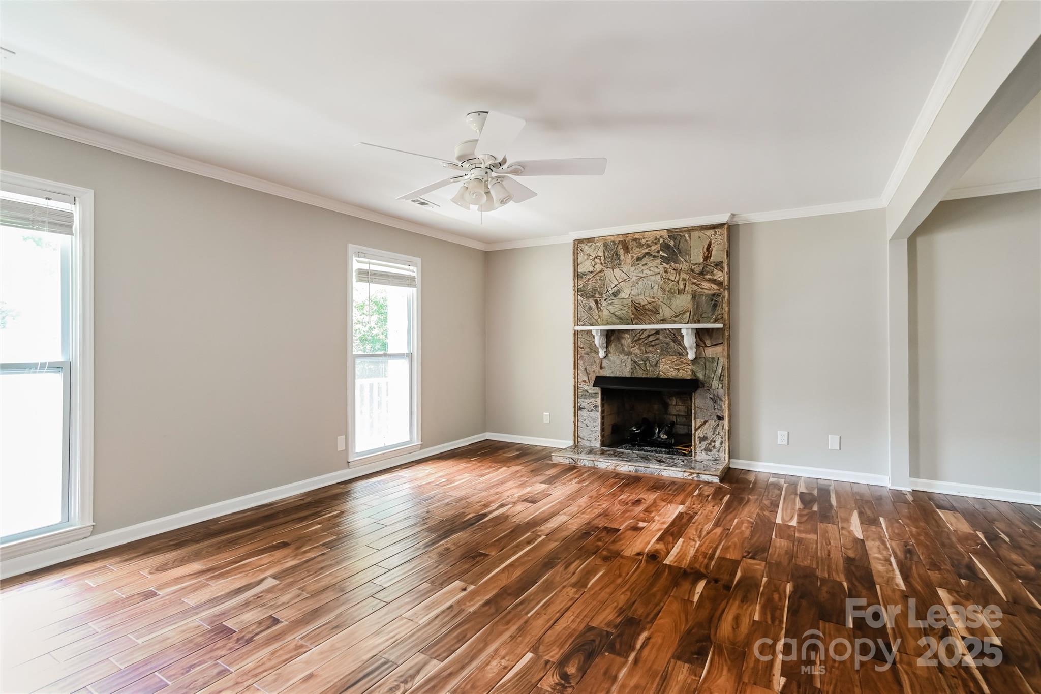2331 Hunters Bluff Drive Matthews, NC 28105 - Photo 3 of 17 wooden floor fireplace and windows in an empty room