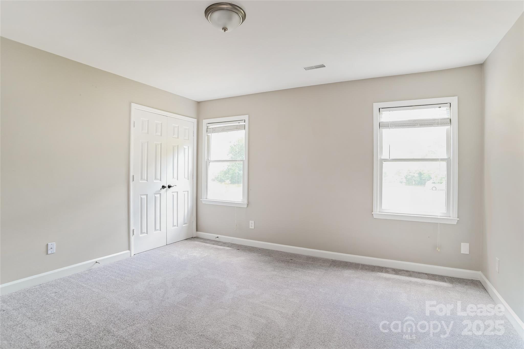 2331 Hunters Bluff Drive Matthews, NC 28105 - Photo 10 of 17 an empty room with windows