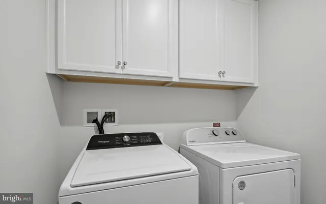 a living room with a table and a microwave