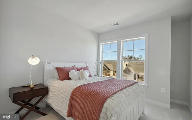 a front view of a building with a yard