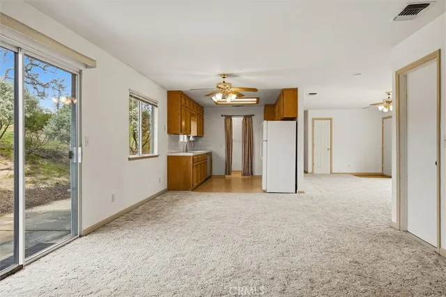 a kitchen with stainless steel appliances granite countertop a sink and cabinets