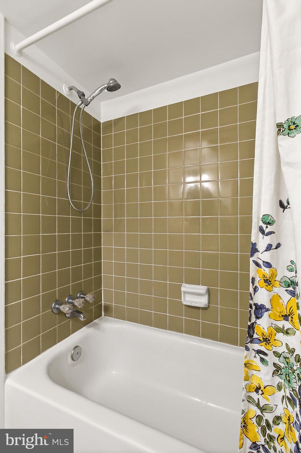 6908 Rochambeau Place Springfield, VA 22153 - Photo 41 of 70 Ceramic tile tub/shower surround in lower lvl Bath