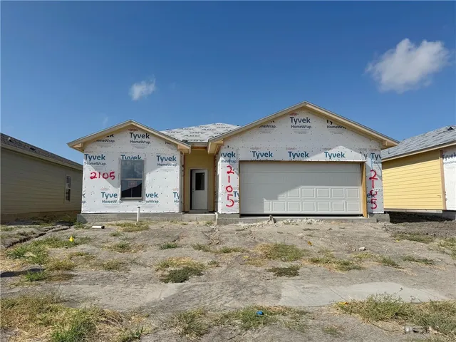 a view of a house with a garage