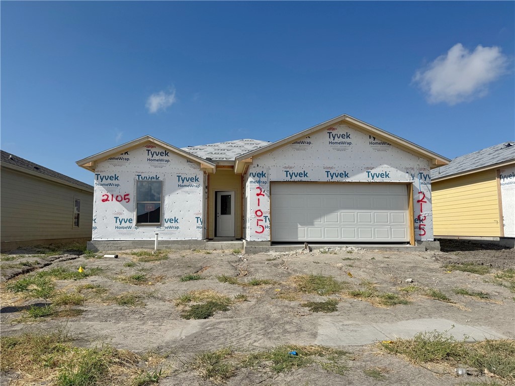 a view of a house with a garage
