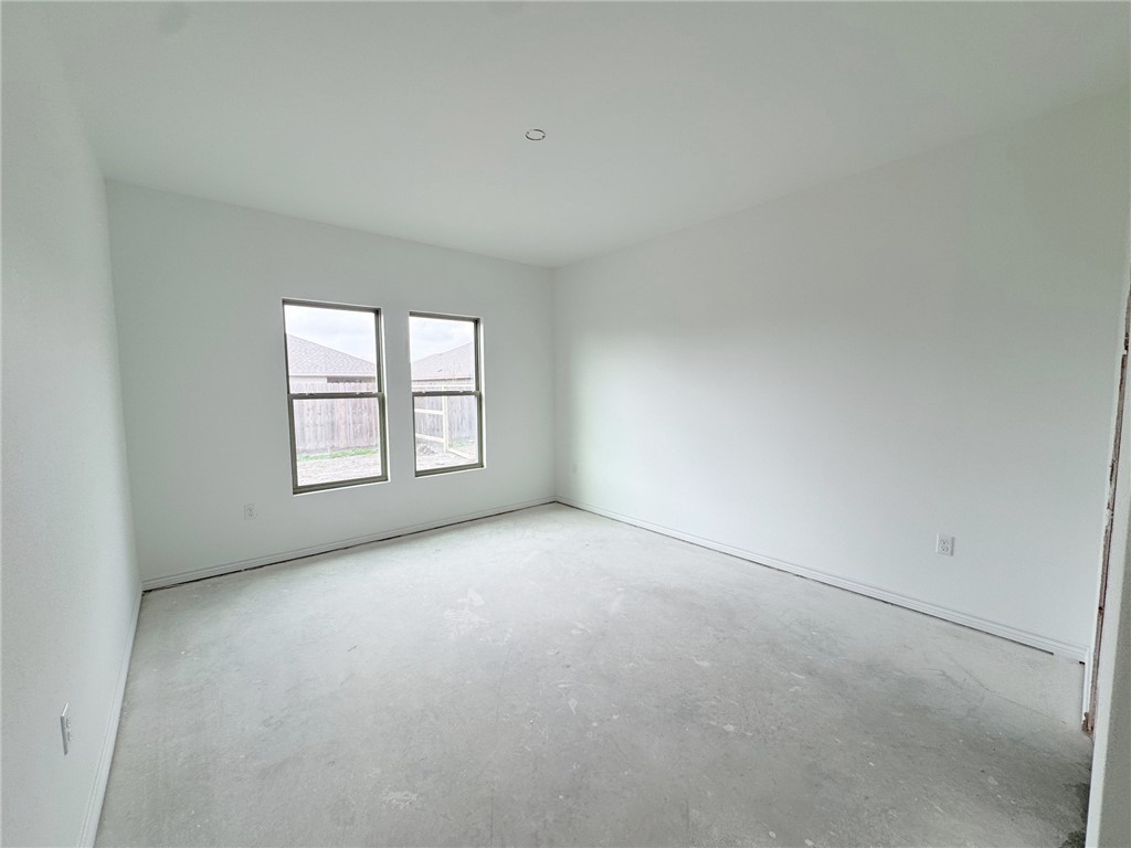 2105 Fury Portland, TX 78374 - Photo 17 of 23 an empty room with windows