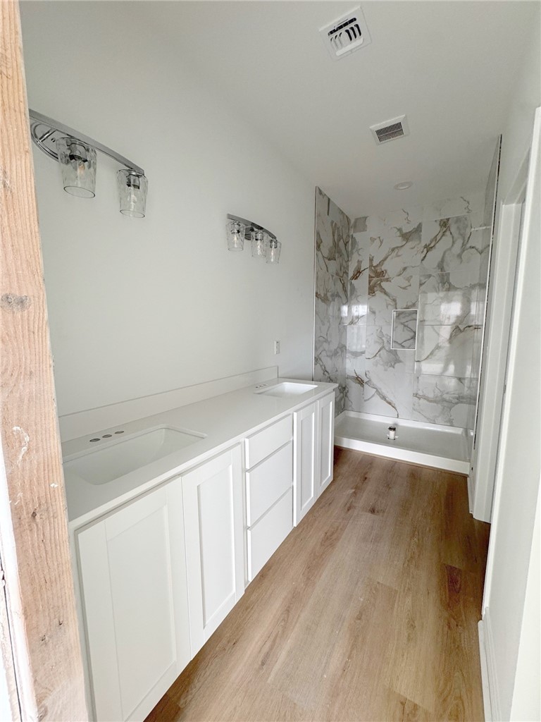 2105 Fury Portland, TX 78374 - Photo 18 of 23 a large white bathroom with a bathtub and shower