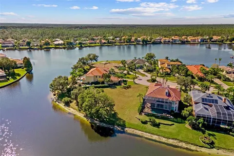 an aerial view of a house with a lake view