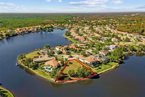 an aerial view of a house with a ocean view