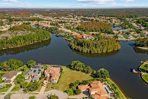an aerial view of a house with a lake view