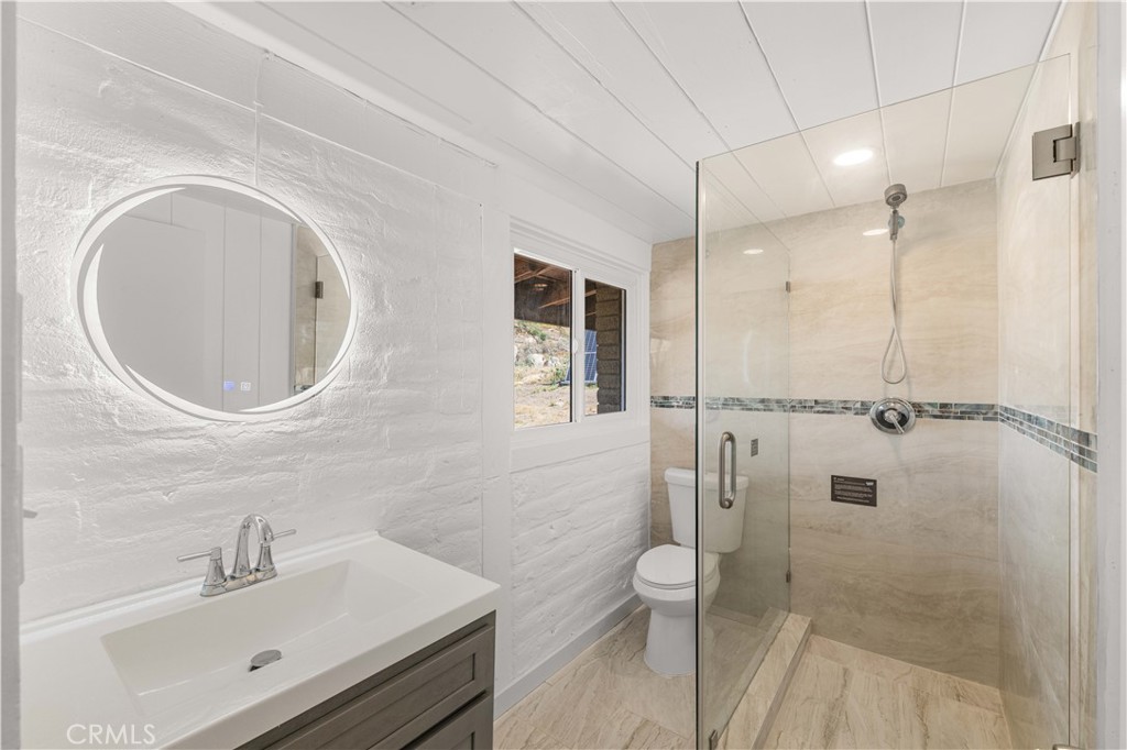 6308 Hawarden Drive Riverside, CA 92506 - Photo 15 of 37 a bathroom with a sink a toilet and shower