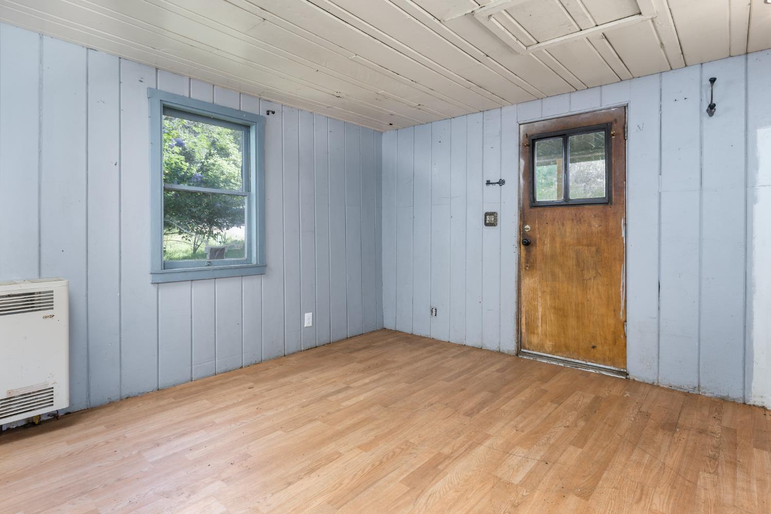 7220 Grizzly Flat Road Somerset, CA 95684 - Photo 5 of 28 an empty room with windows and closet