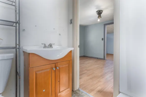 a bathroom with a sink a mirror and shower