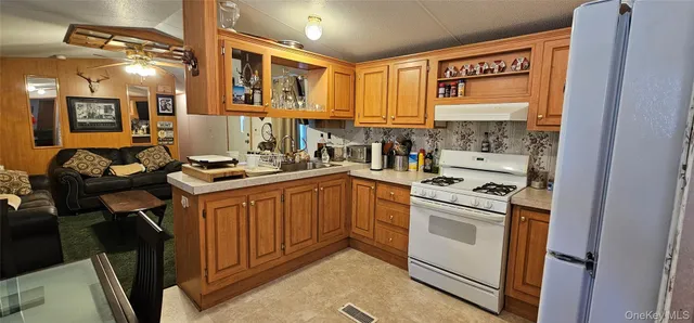 a kitchen with a sink cabinets and appliances