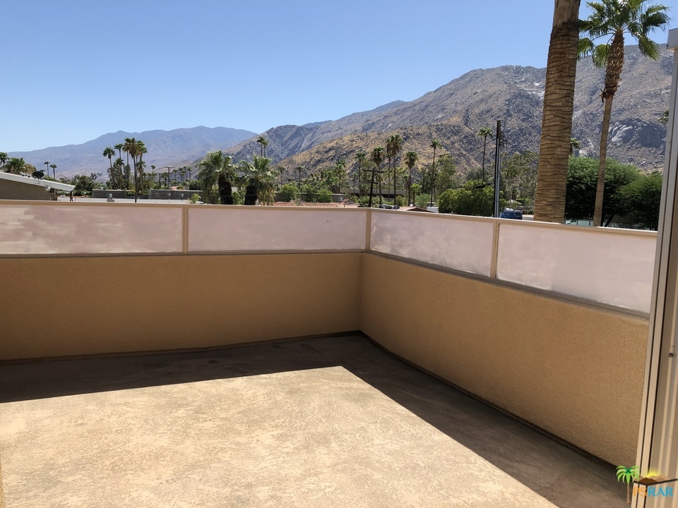 100 East Stevens Road, Unit 509 Palm Springs, CA 92262 - Photo 2 of 37 a view of balcony with a couple of trees