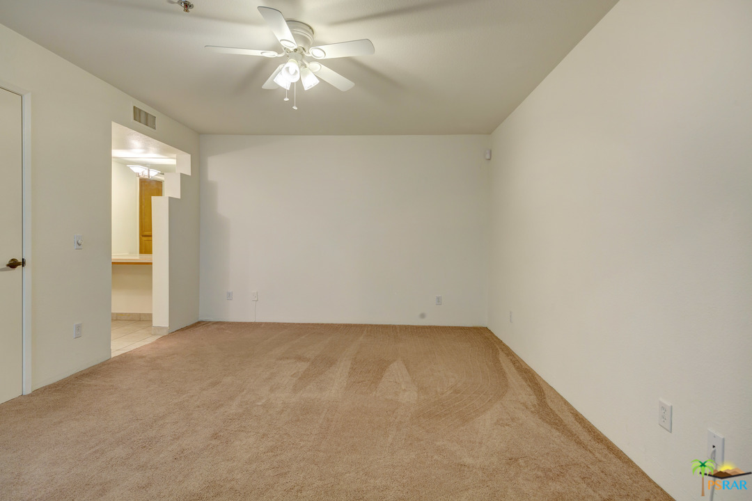 100 East Stevens Road, Unit 509 Palm Springs, CA 92262 - Photo 19 of 37 a view of an empty room and chandelier fan