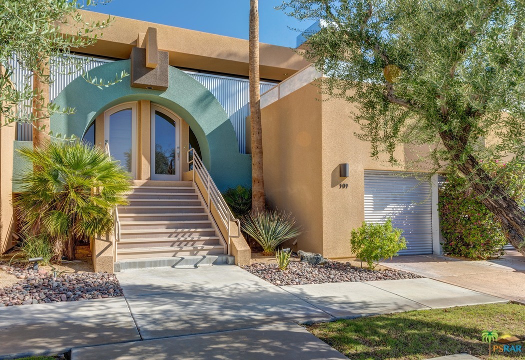 100 East Stevens Road, Unit 509 Palm Springs, CA 92262 - Photo 3 of 37 a front view of a house with garden